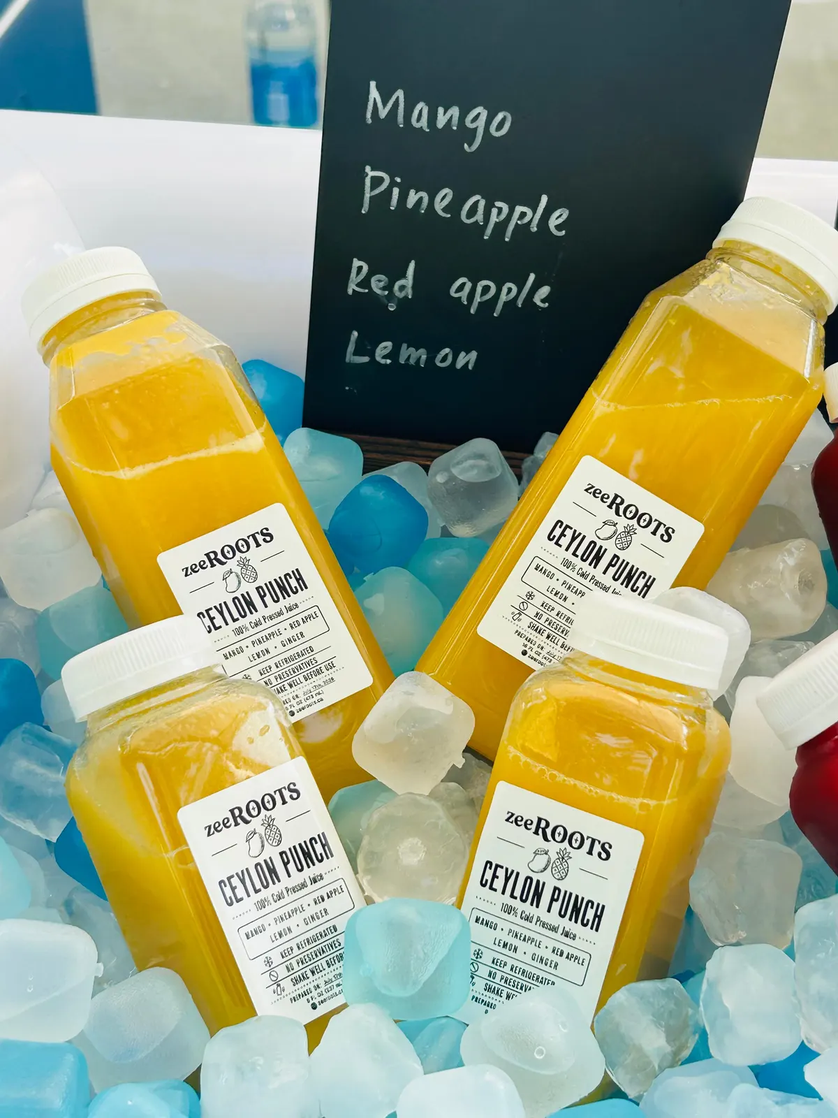 zeeROOTS cold-pressed juice market stall display